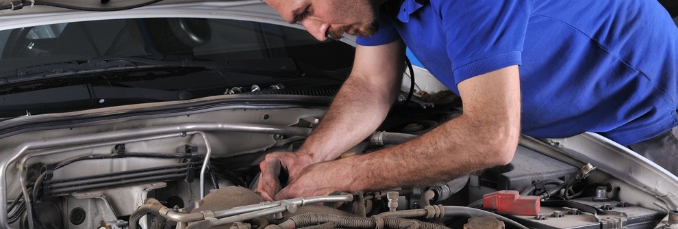 Man working on car engine