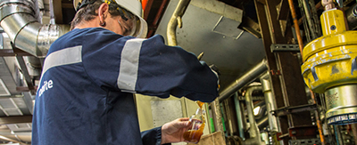 Man testing oil